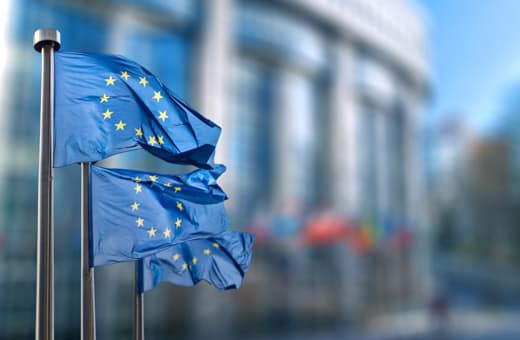 European Union flags outside a building